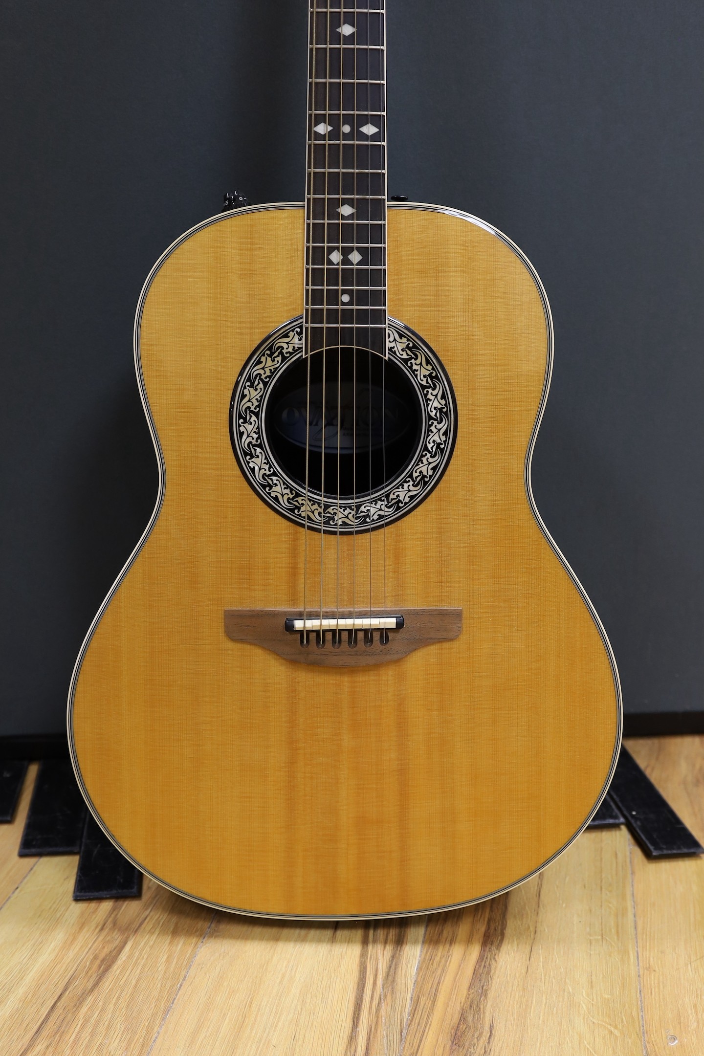 An Ovation acoustic guitar in case